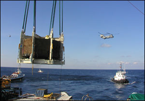 monitor's turret being lifted from water