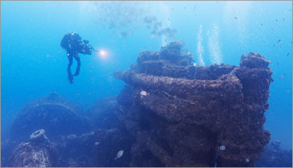 diver photographing a wreck