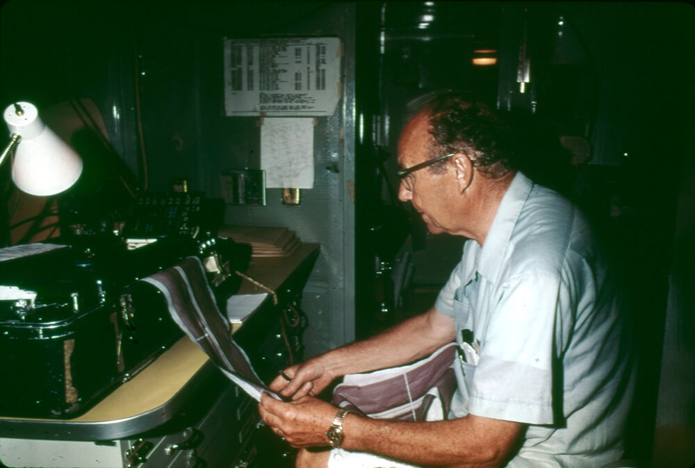 a man printing segments of the monitor photomosaic