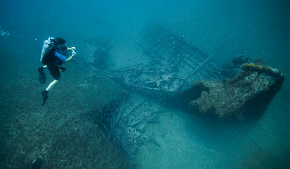 NOAA diver takes images of the bow section of W.E. Hutton