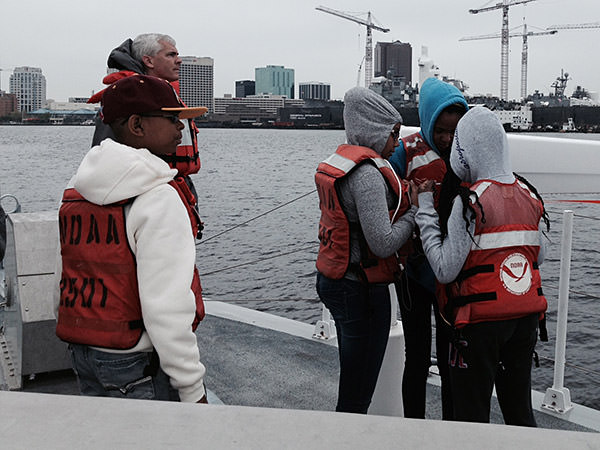image of students on a boat