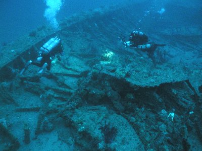 Two divers near a Shipwreck