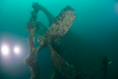 A diver inspects Merak’s propeller and rudder post